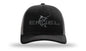 A black Engel Black & Charcoal 112 Trucker Cap by Richardson® with the word "Engel" embroidered on it, featuring a snapback closure.