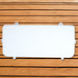 A white Engel Coolers seat cushion on a wooden surface.