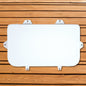 A white sheet of paper on a wooden background with an Engel Coolers white seat cushion for Engel Hard Cooler.