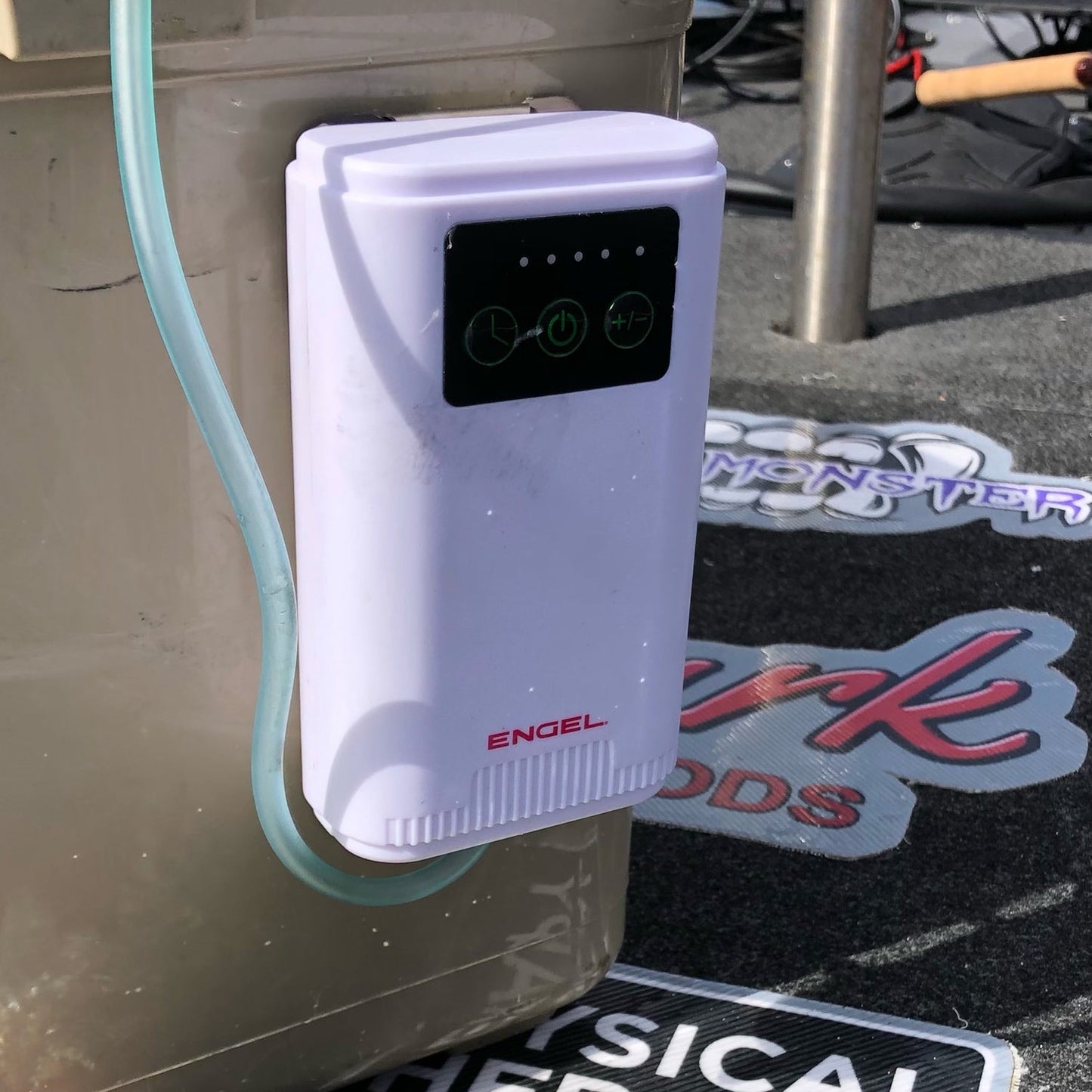 A white Engel Coolers device with a hose attached to it.